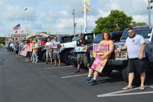 christmas in july toy drive ocean city md people in parking lot and cars